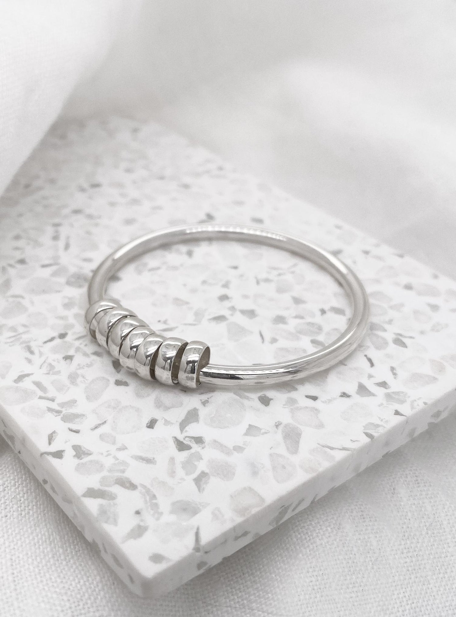 7 Lucky Rings Charms 3mm Round Gold Bangle in Sterling Silver